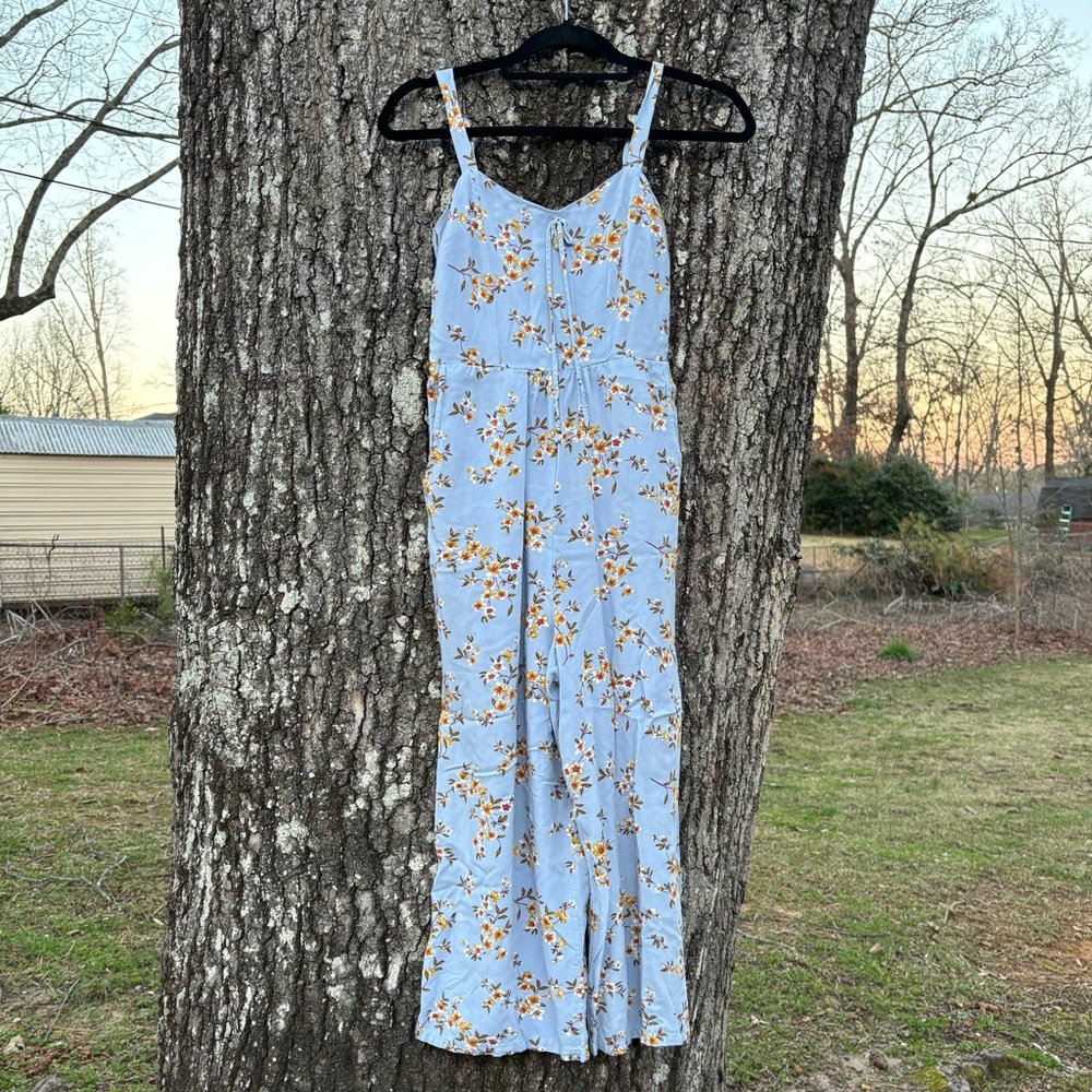Light blue small jumpsuit with yellow flower design